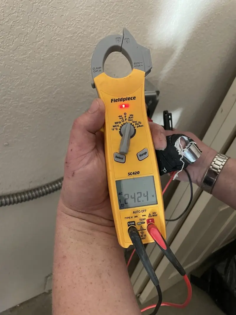 Voltage testing with clamp meter during Aluminum Wiring Replacement in Perry
